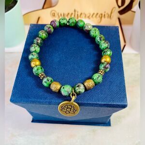 Ruby Zoisite Lotus Antique Bronze Finish Charm Stretch Bracelet